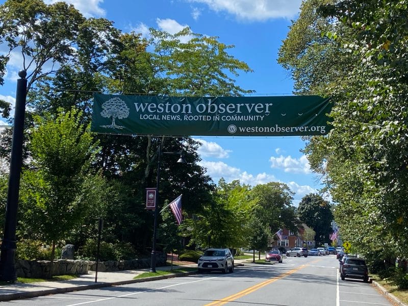 Weston Observer banner over Boston Post Road in Weston Center.